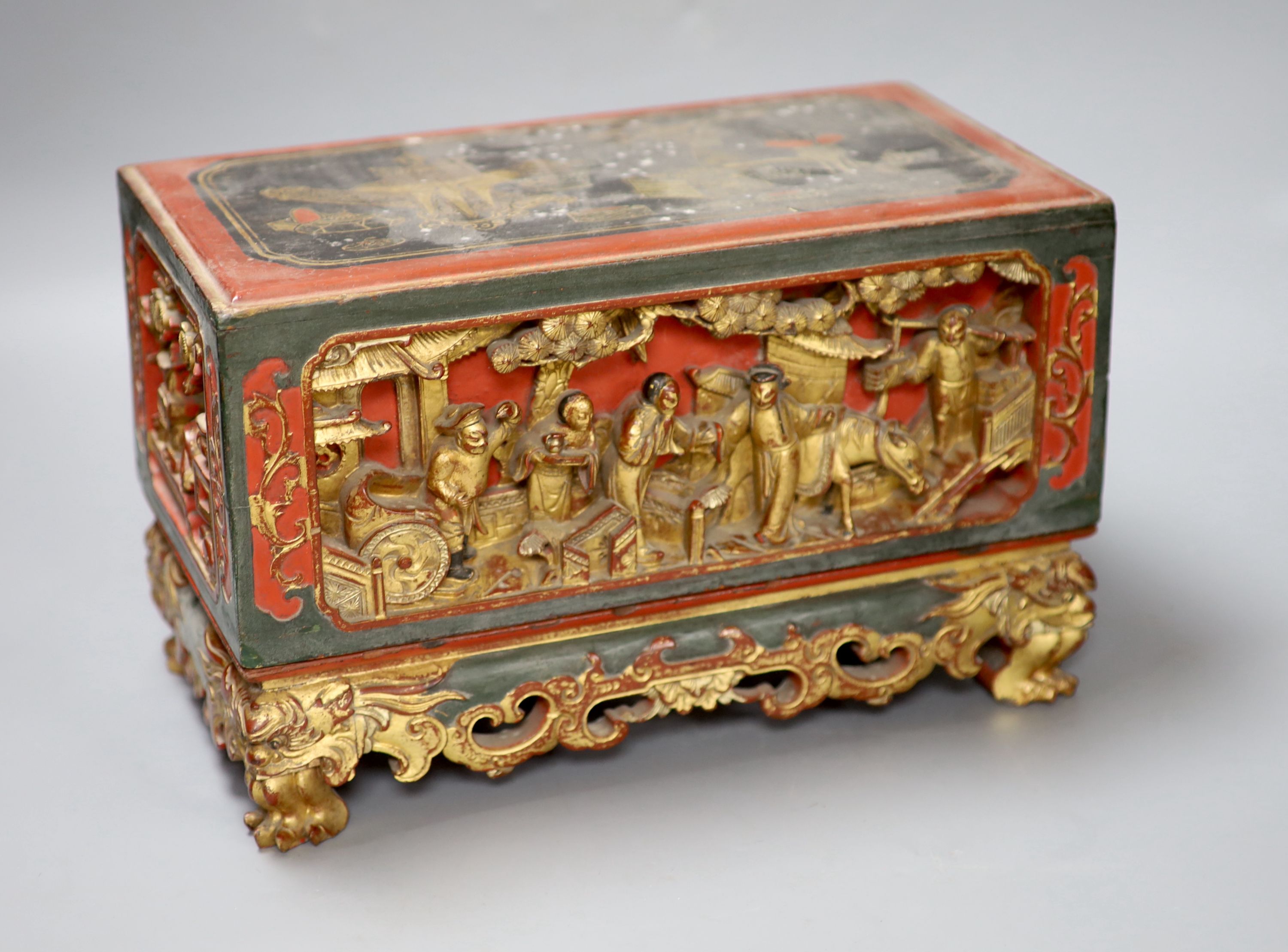 A 19th century Chinese red lacquer and gilt offering box (chanab), length 33cm